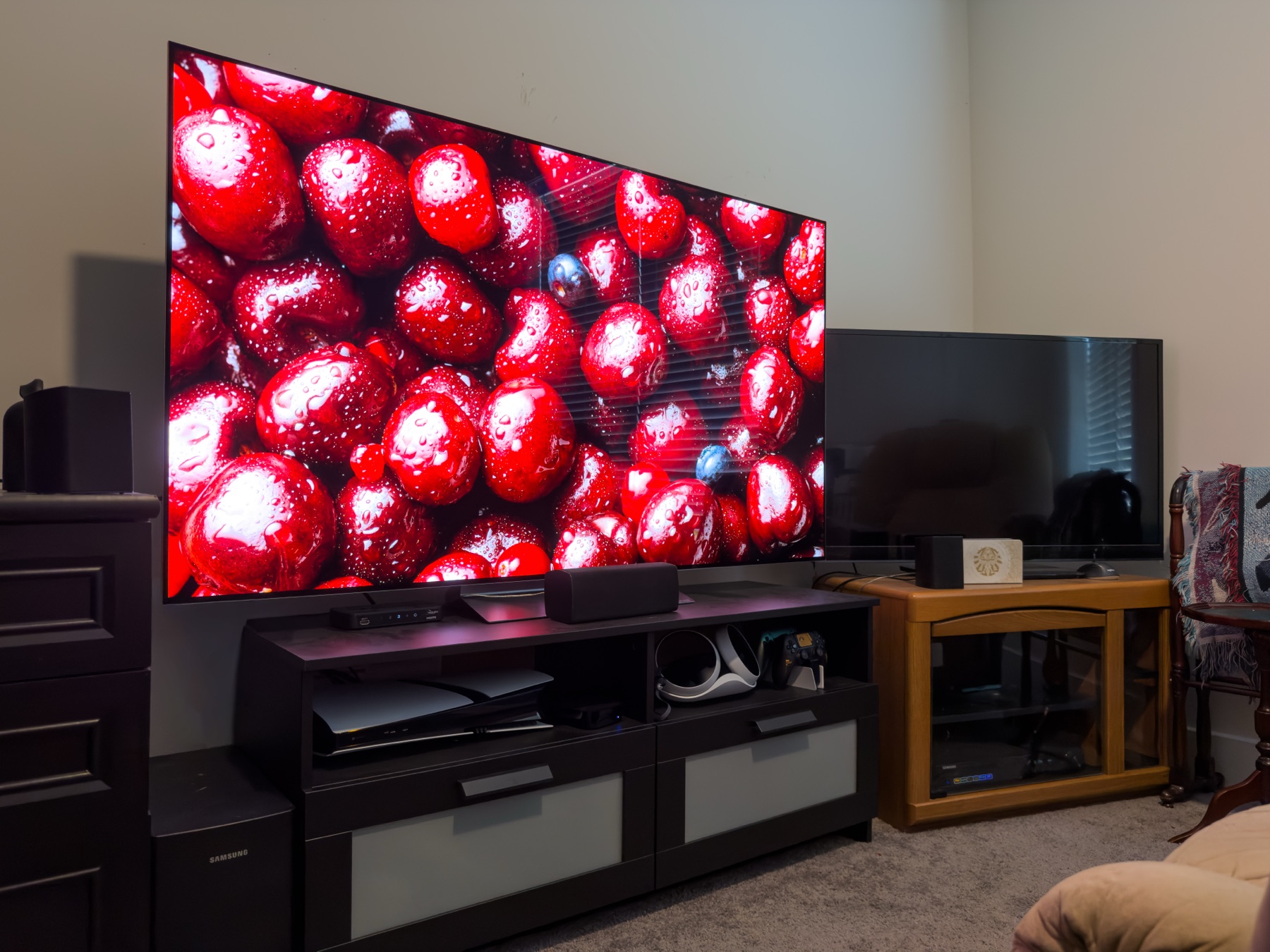 Wall-mounted living room TV with surround speakers and hidden wiring
